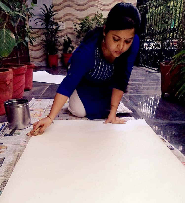 Mithila artist preparing surface 1