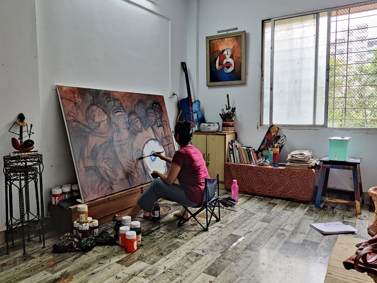 Deepa Vedpathak contemporary Indian artist - painting in her studio