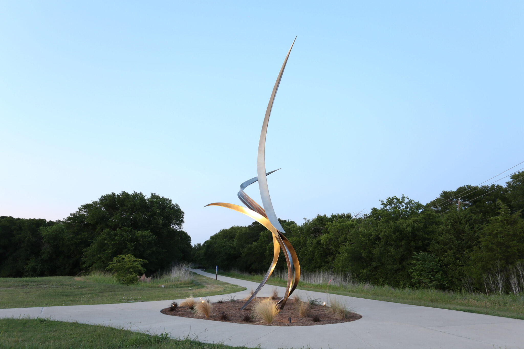 Entwine, a 33-foot stainless steel and bronze public sculpture by Michael Szabo in Texas