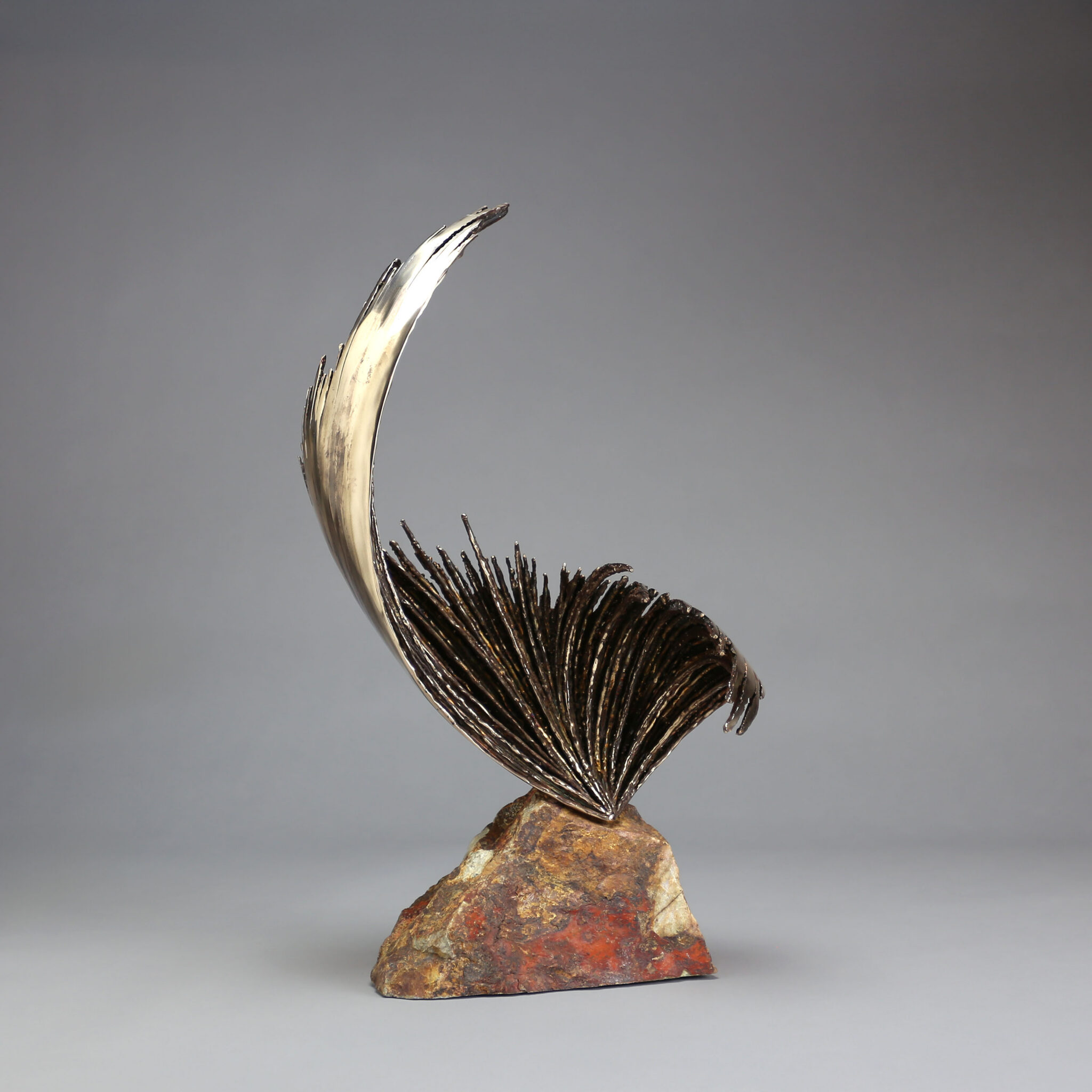 Swell by Michael Szabo, an abstract bronze and stone sculpture, 25 x 15 x 9 inches